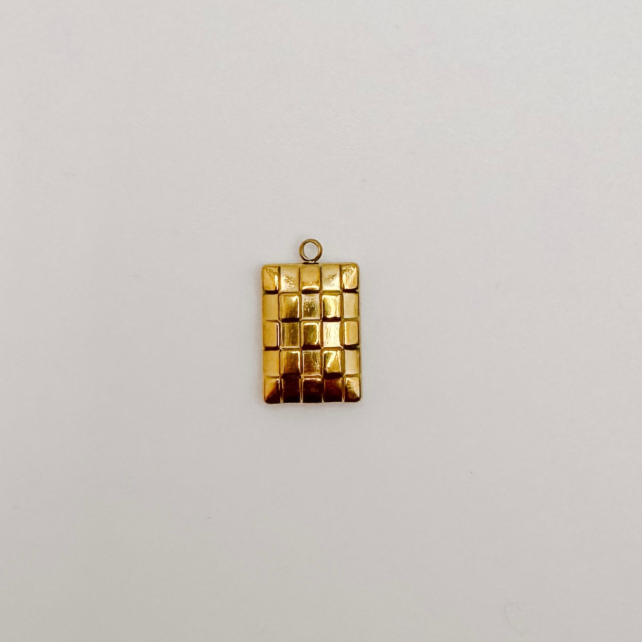 Small gold checkered rectangle
