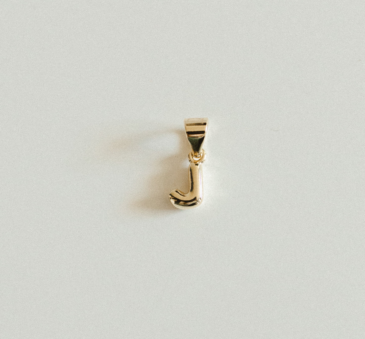 Tiny gold bubble letters A-Z