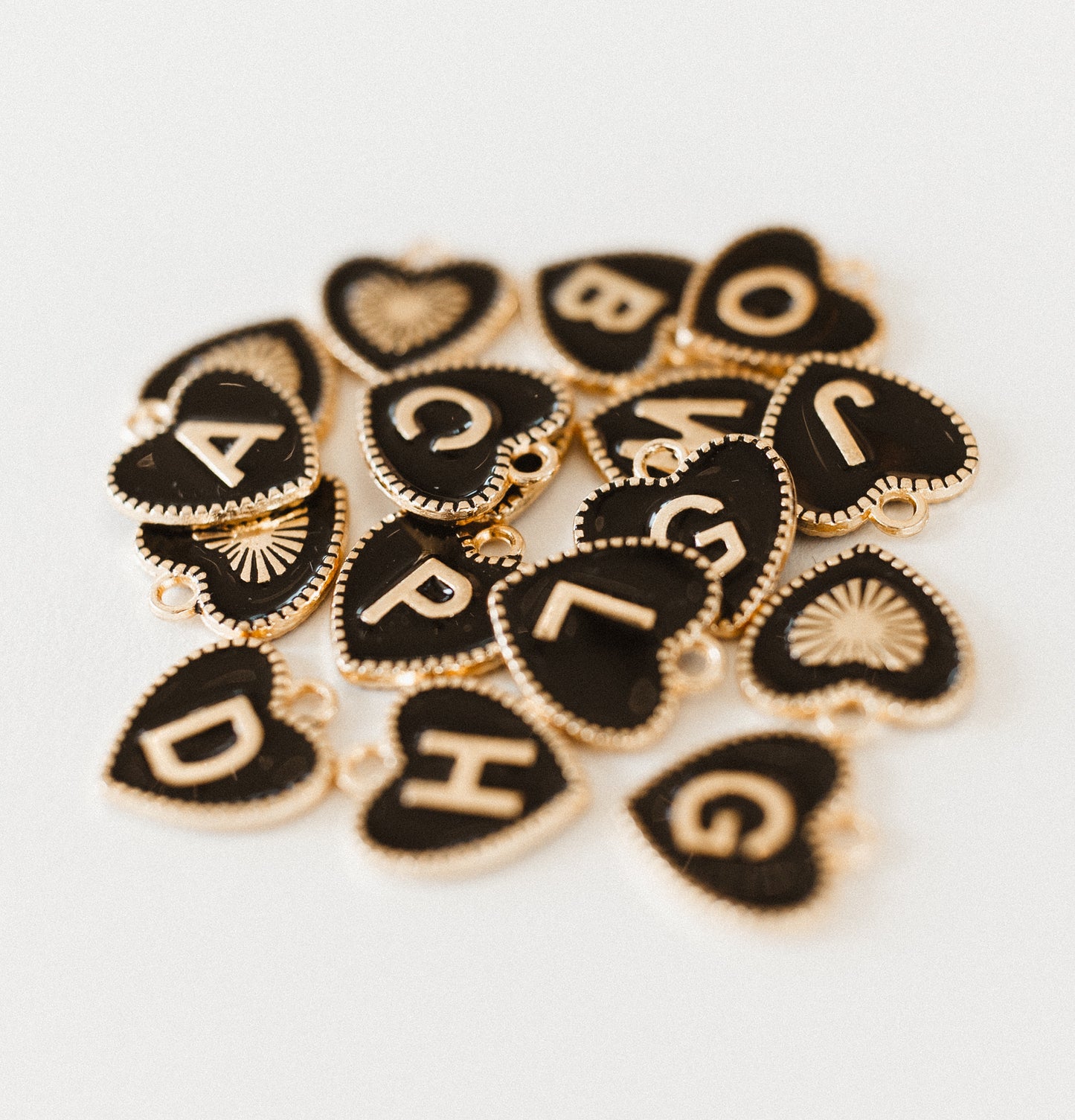 Gold black heart letter A-Z