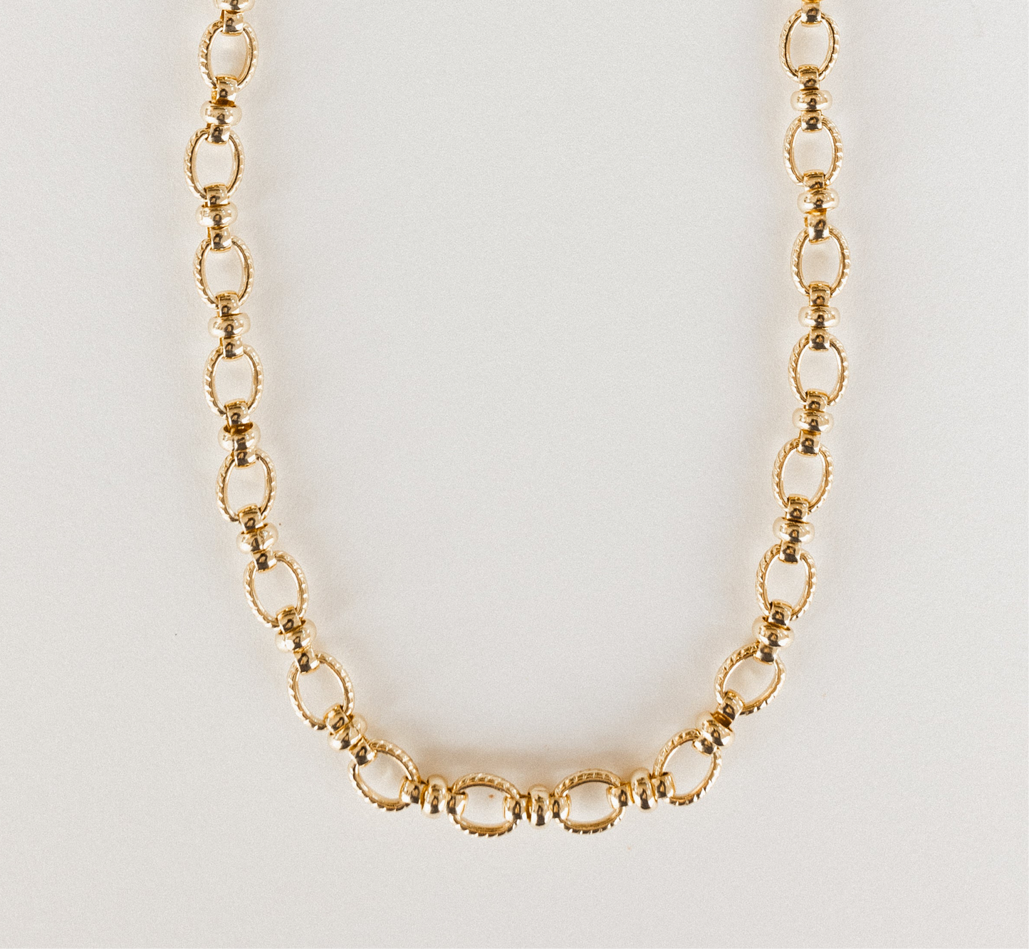 Gold chunky oval and knot necklace