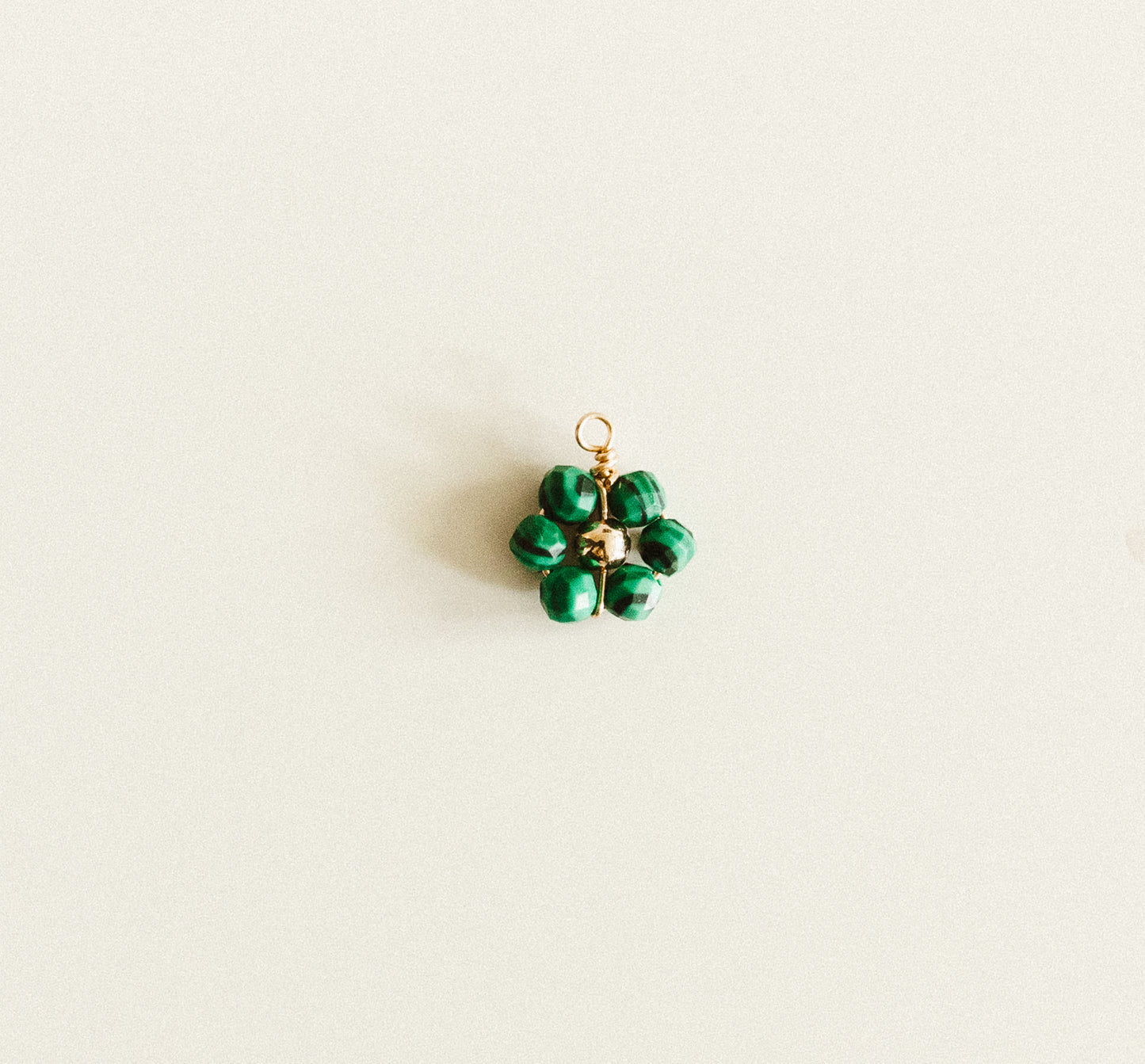 Small gold dark green stripes bead flower