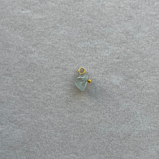 Tiny gold light green gem