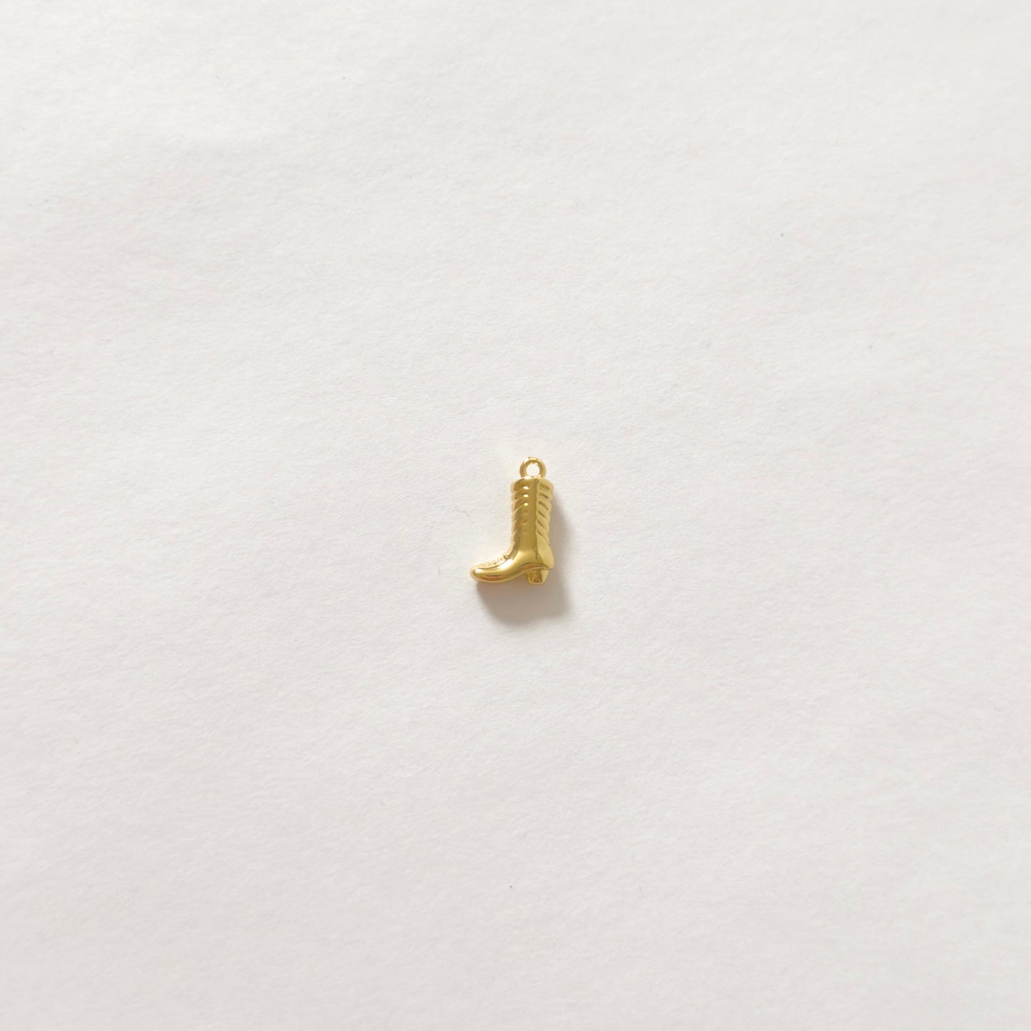Tiny gold cowboy boot