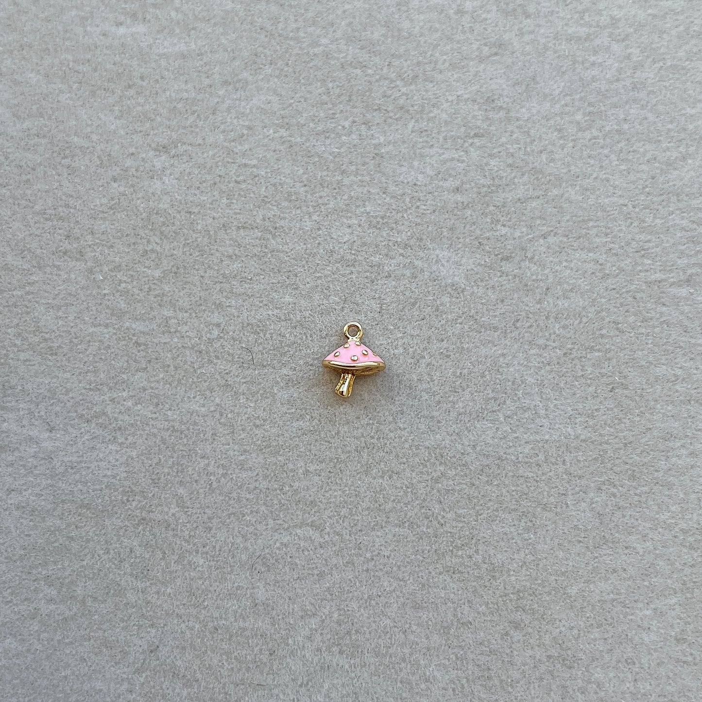 Tiny gold pink mushroom