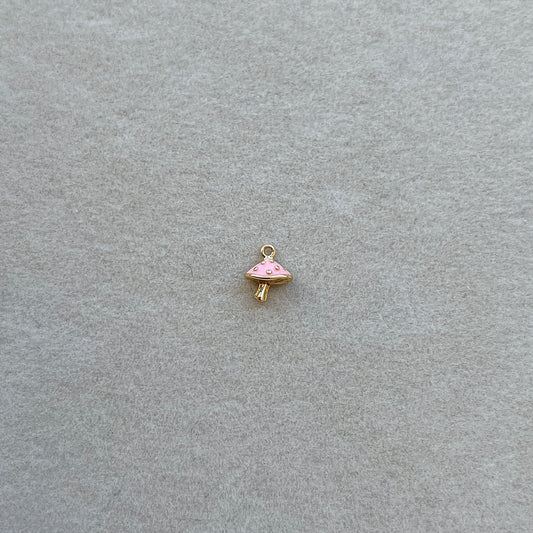 Tiny gold pink mushroom