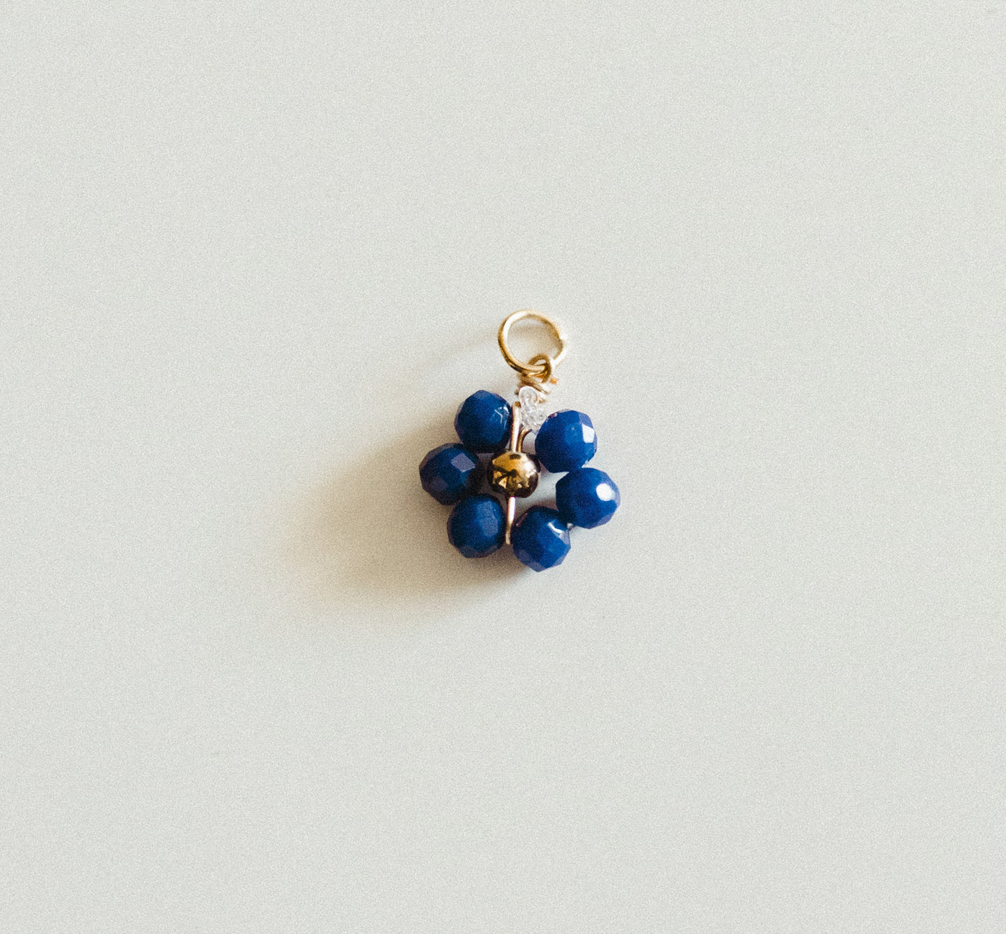 Small gold blue bead flower