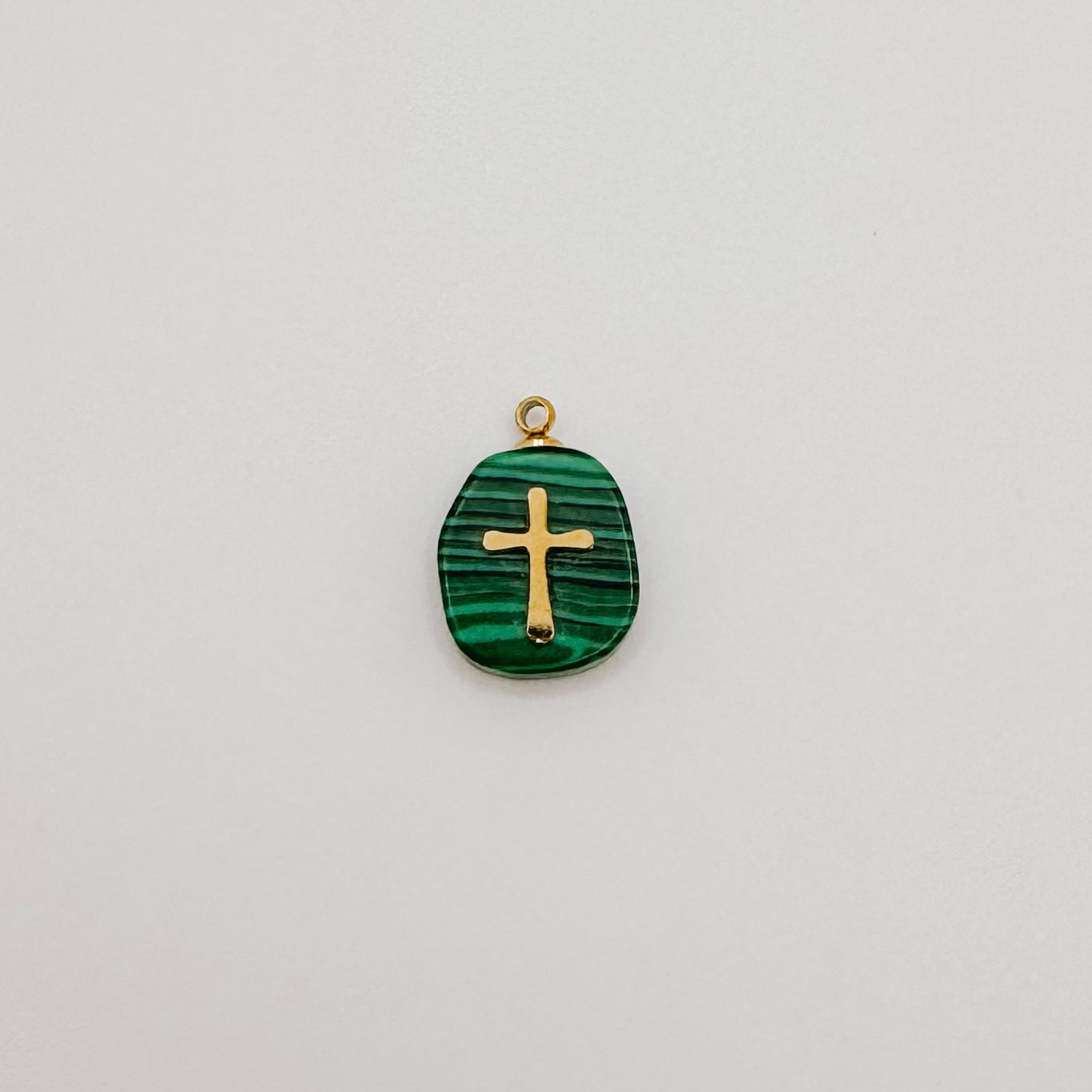 Gold green gem cross