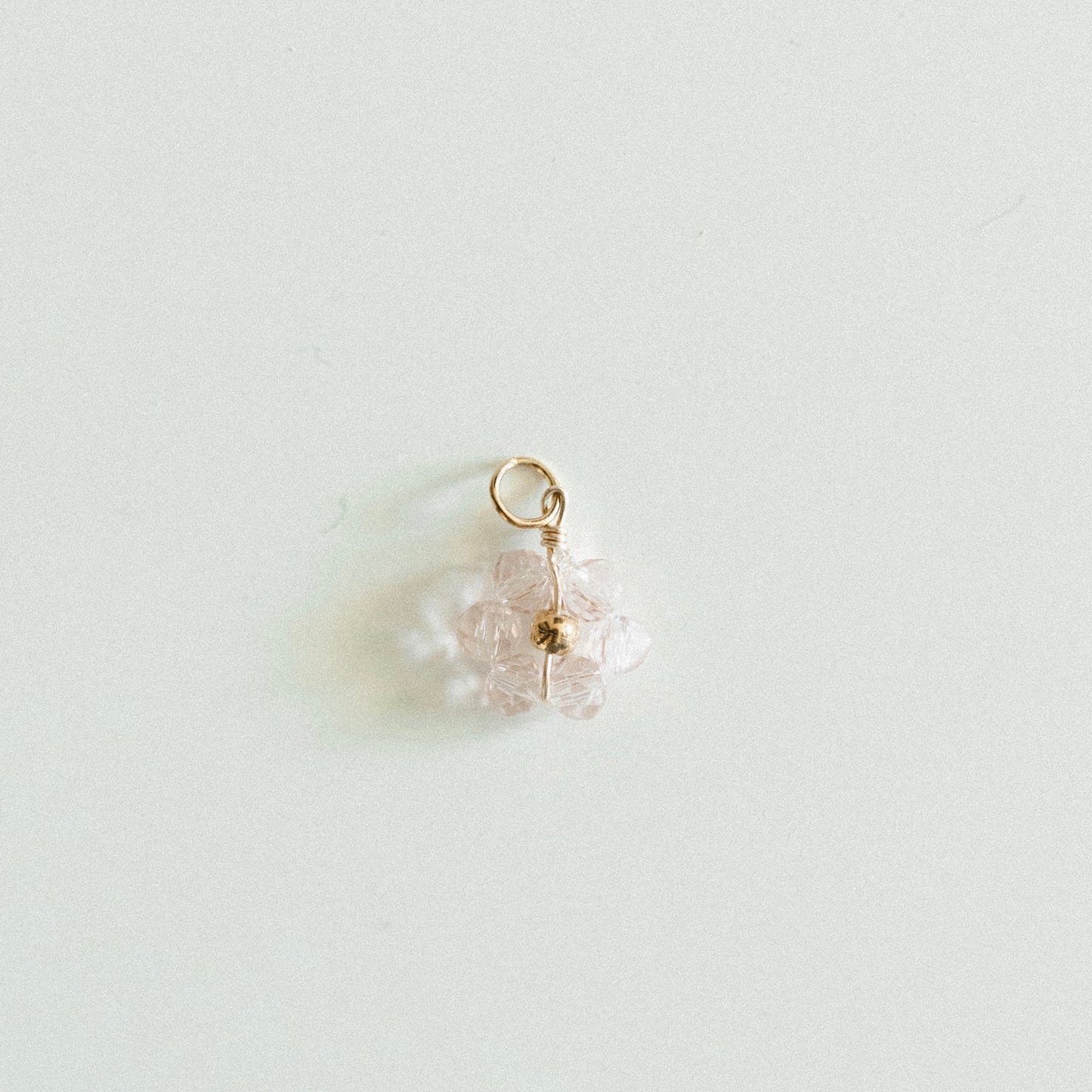 Small gold light pink bead flower