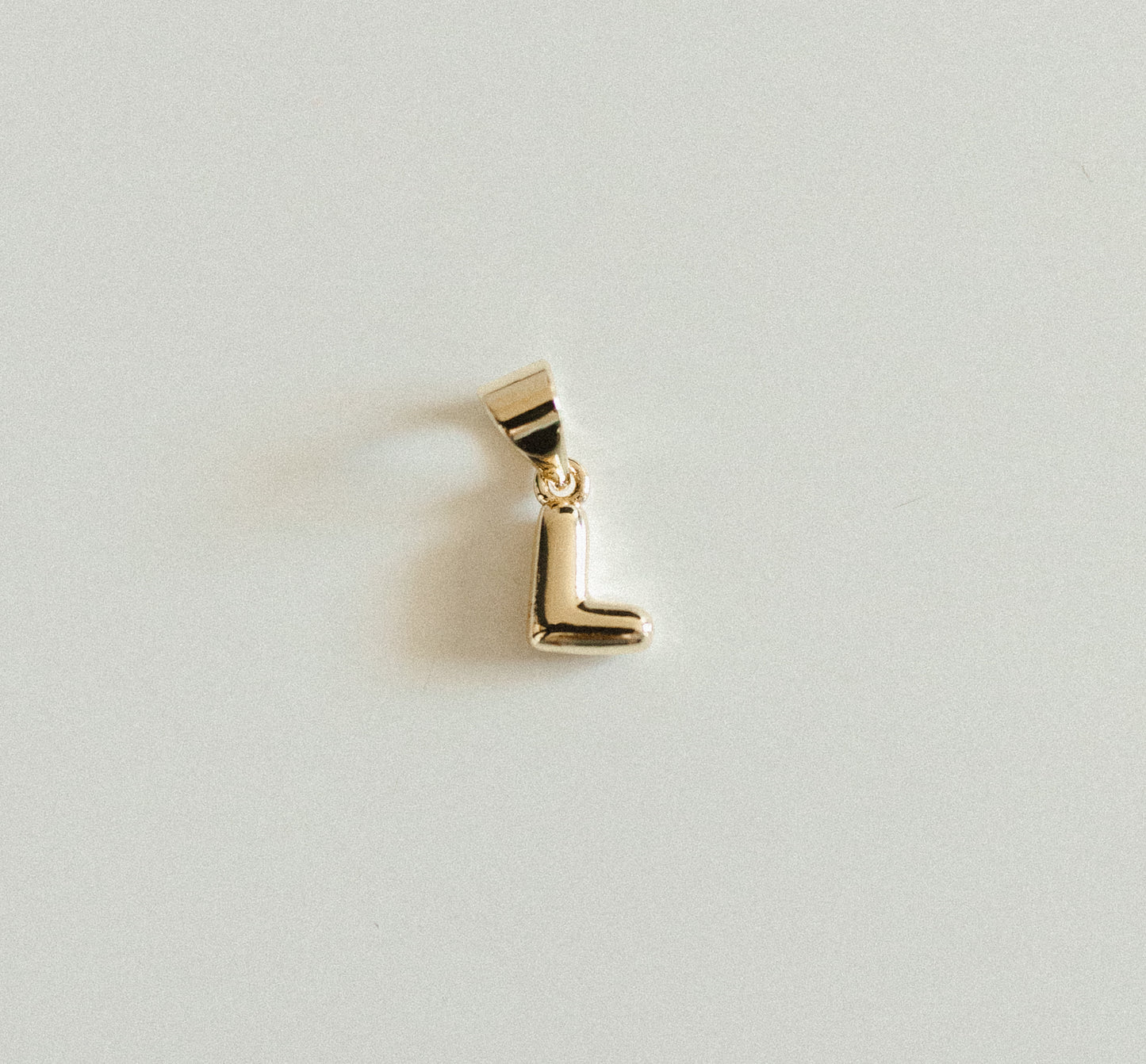 Tiny gold bubble letters A-Z