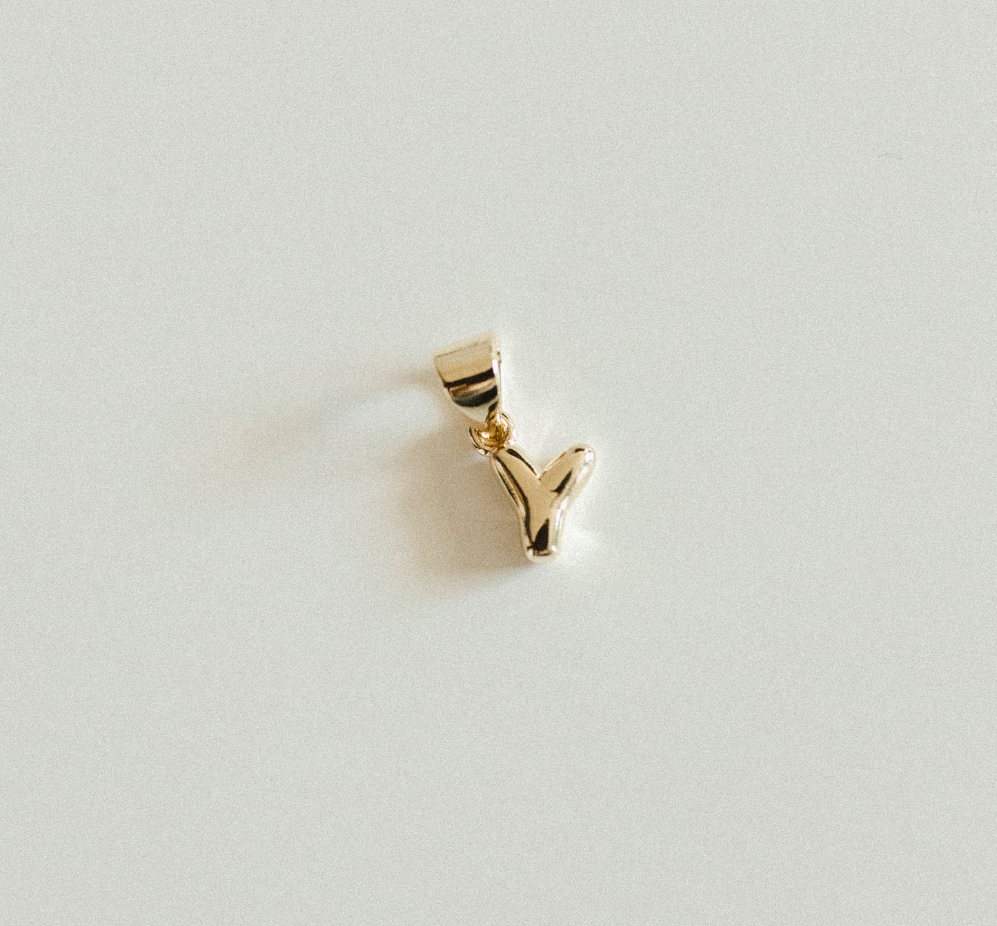 Tiny gold bubble letters A-Z