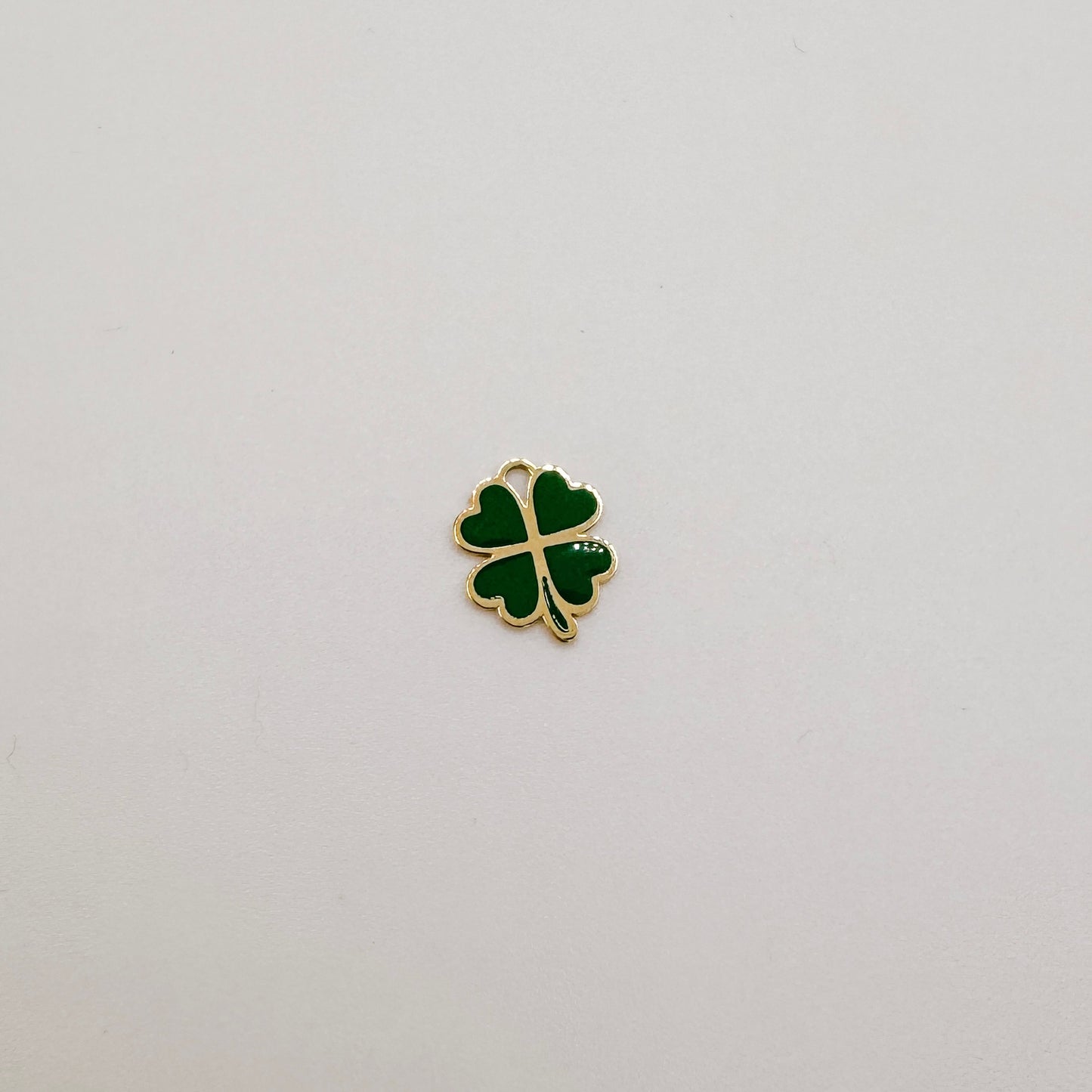 Gold green four leaf clover