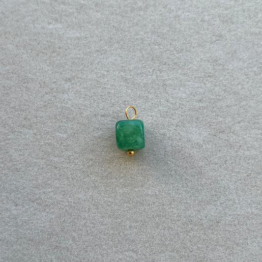 Small gold green gem