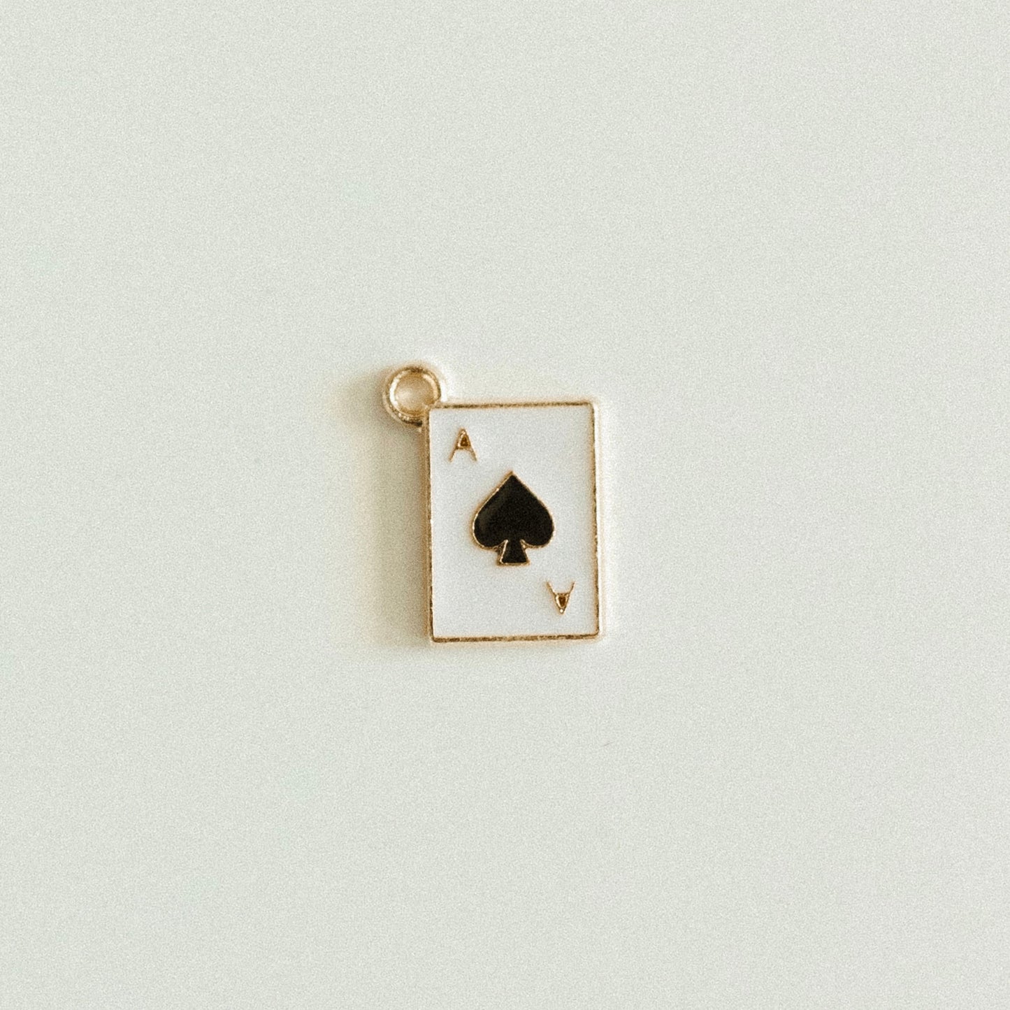 Small gold black ace of spade card