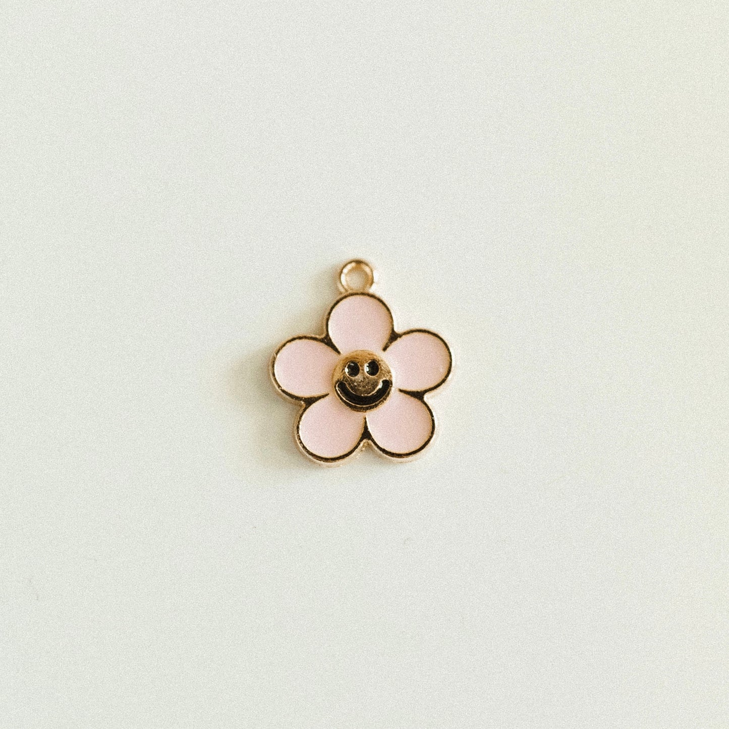 Gold pink smiley flower