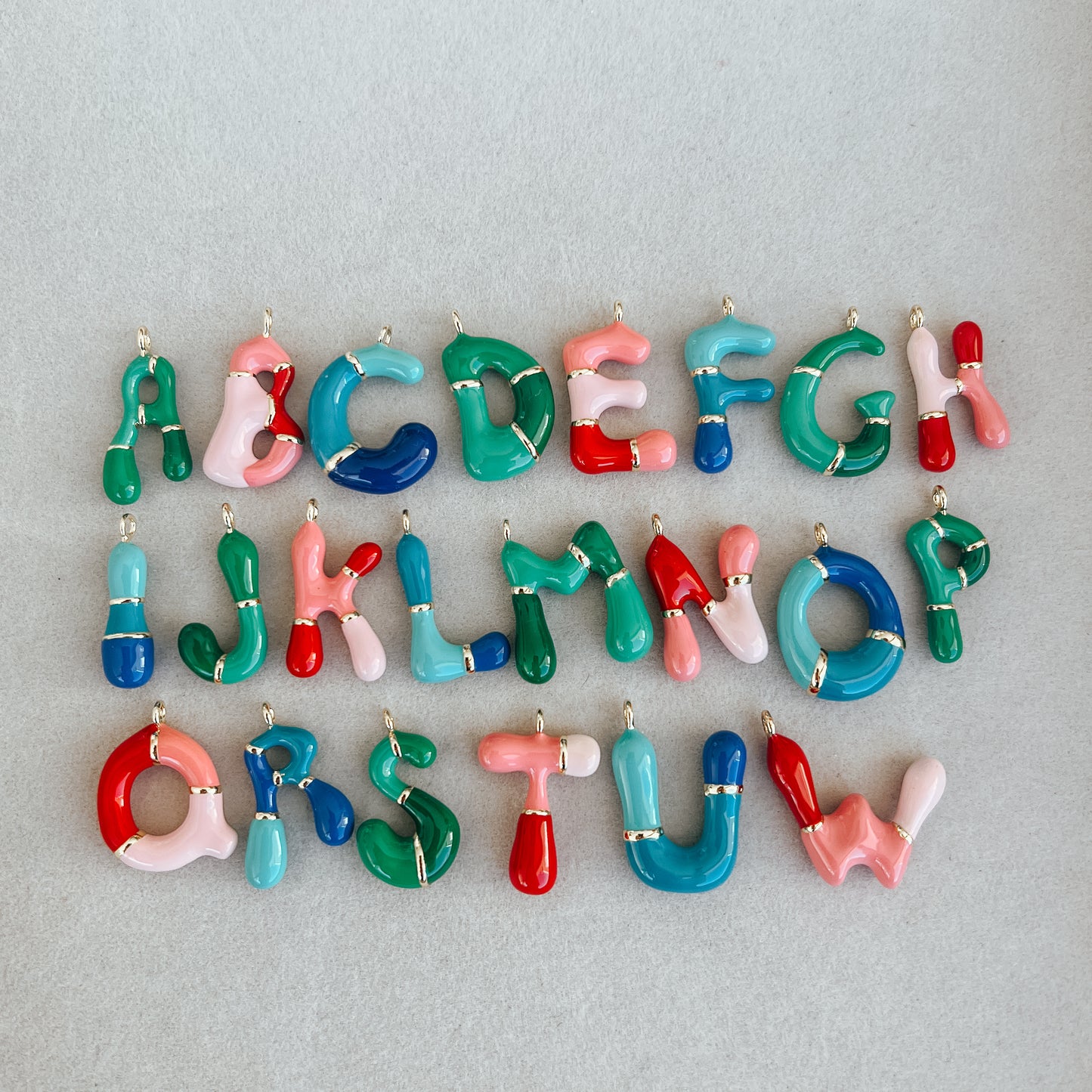 Large gold colored bubble letters A-Z