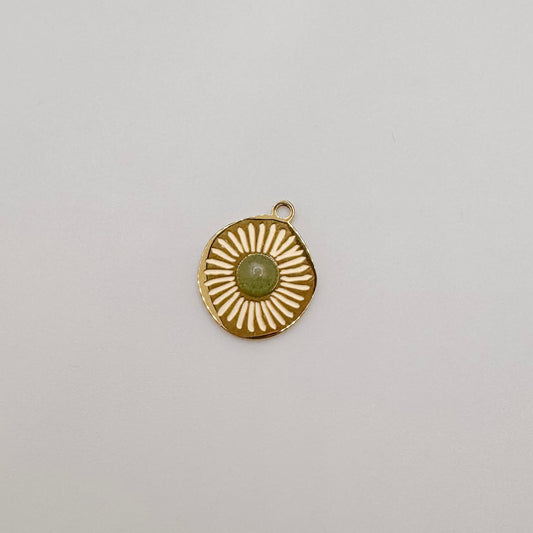 Gold textured circle with light green gem