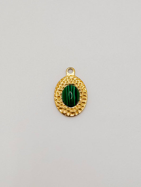 Gold oval green gem