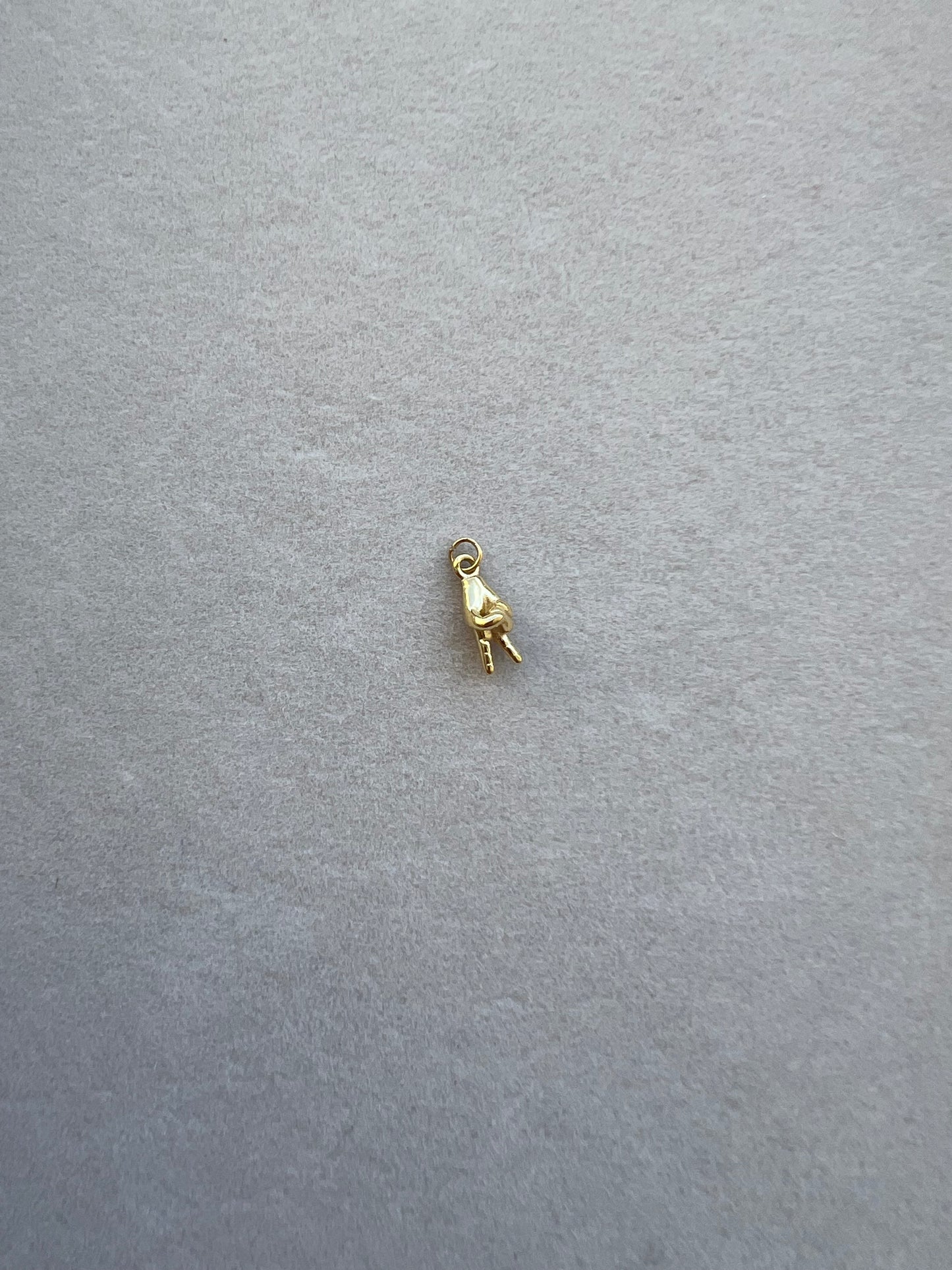 Tiny gold peace sign