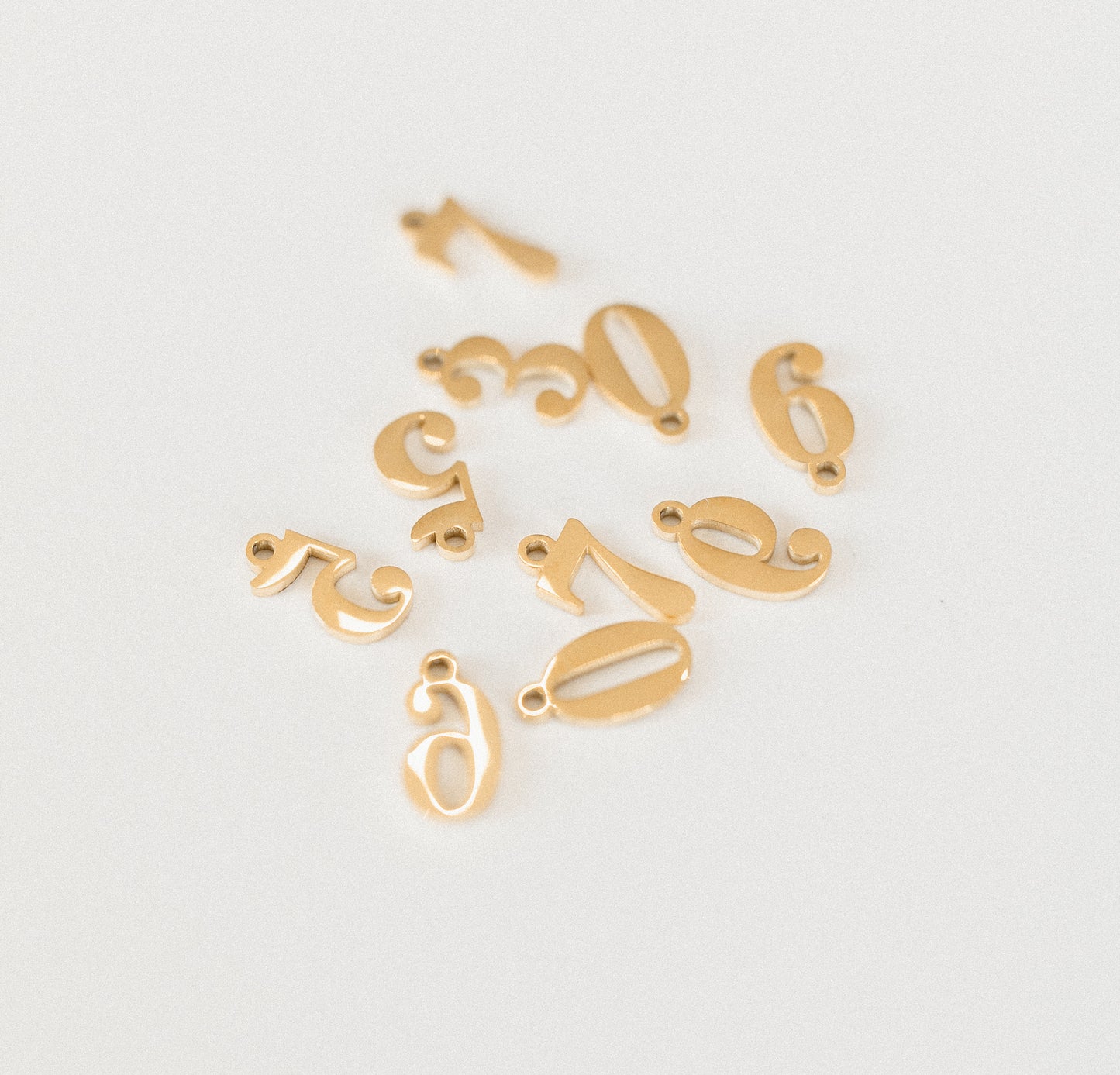 Gold number charms