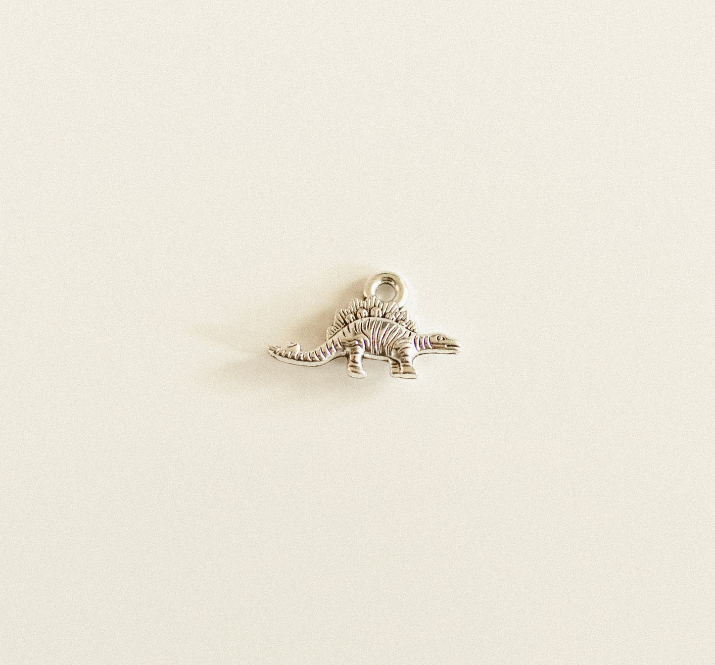 Tiny silver Dino