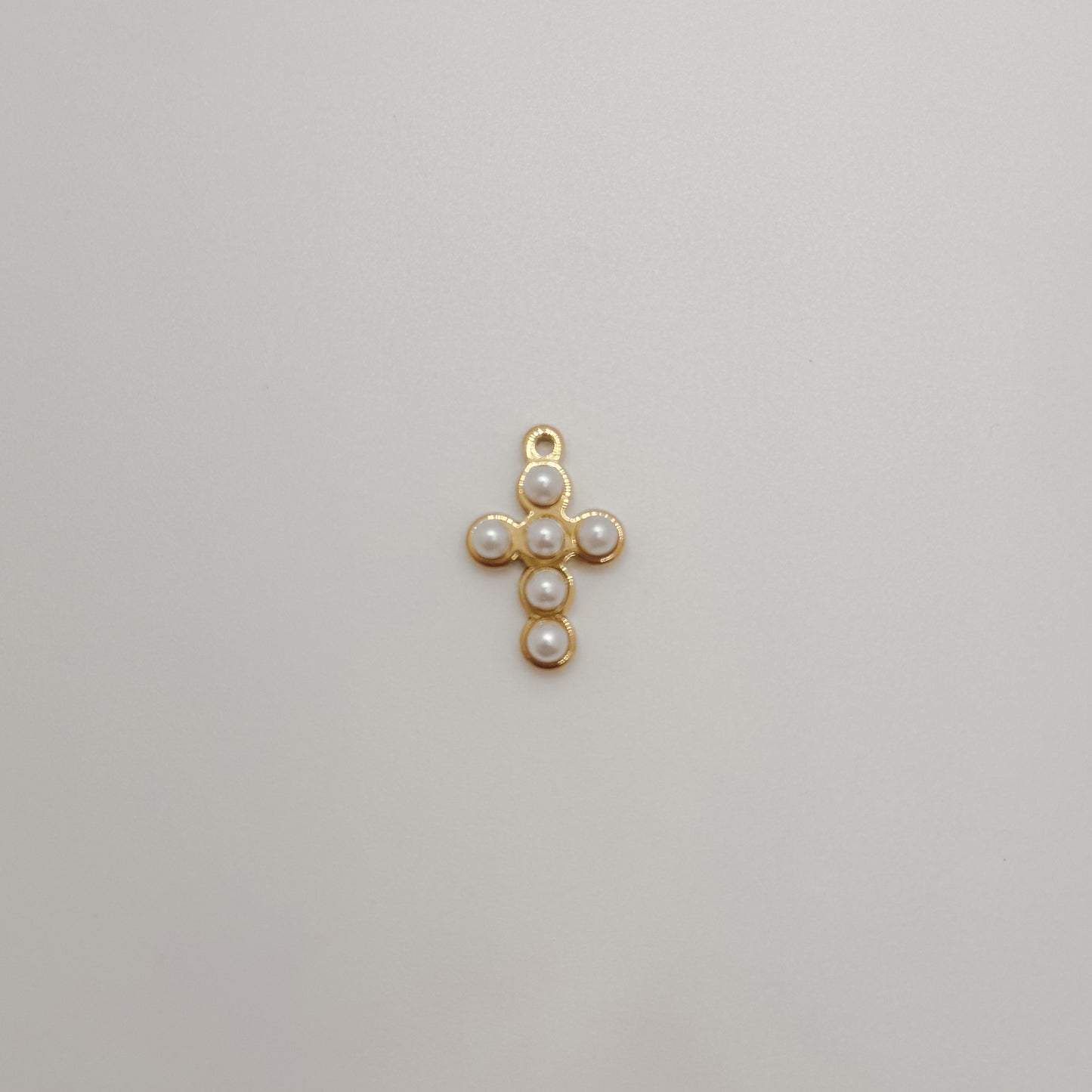 Small gold pearl lined cross