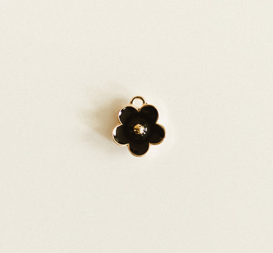 Small gold black flower