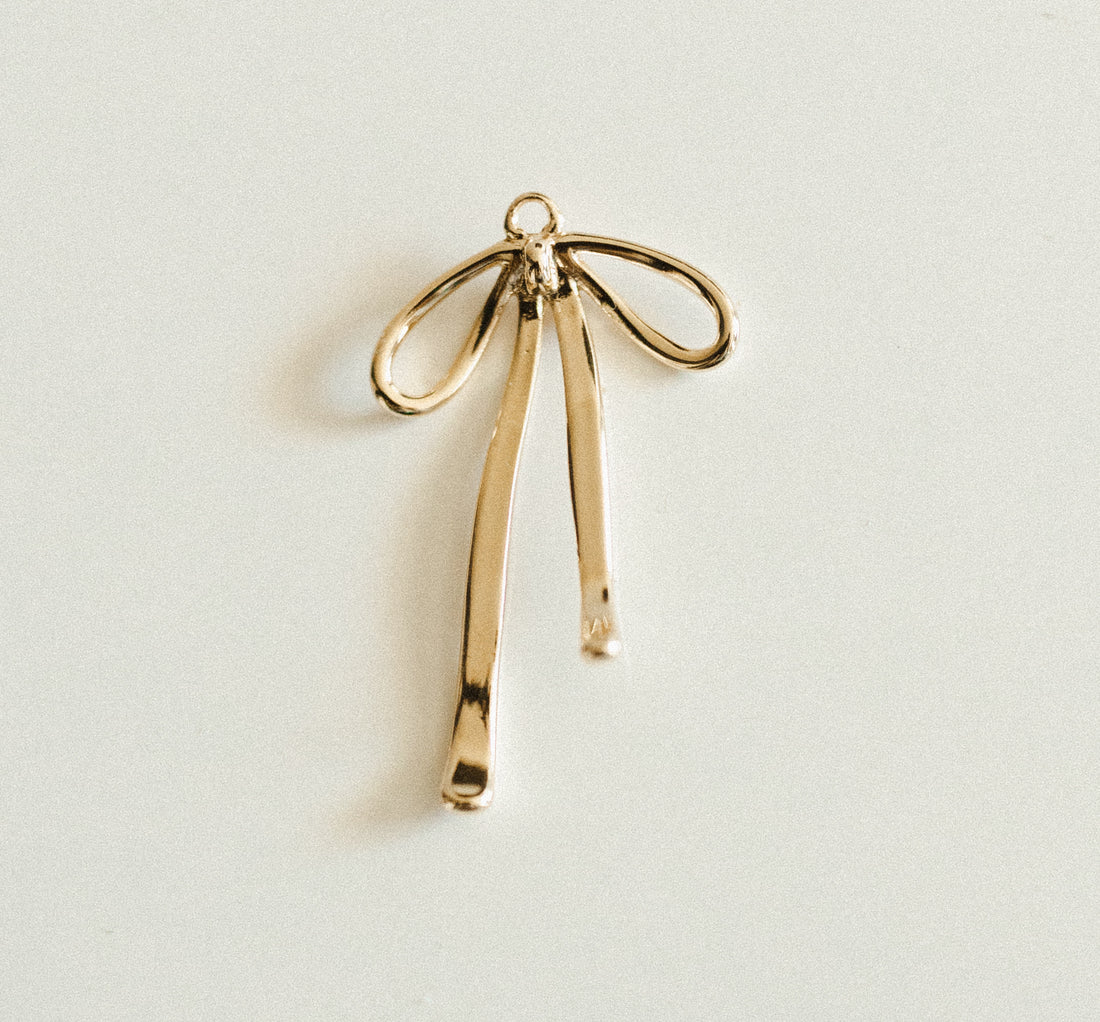 Large gold droopy bow – Unjaded Charms