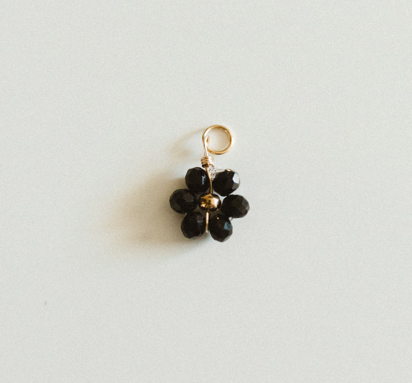 Small gold black bead flower