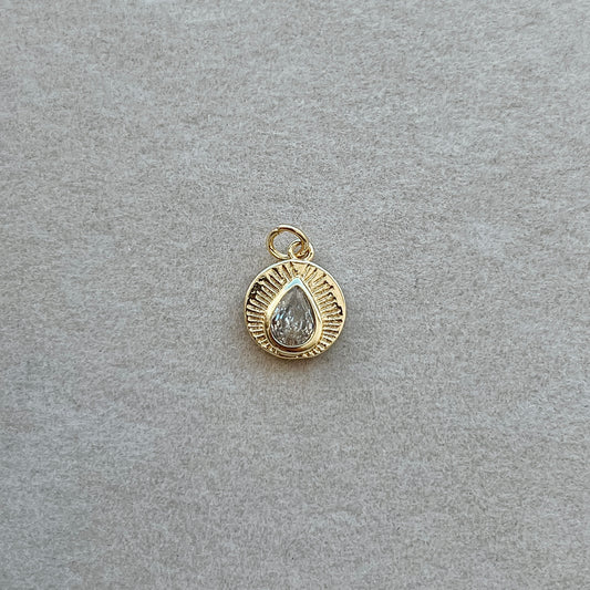 Small gold circle with diamond