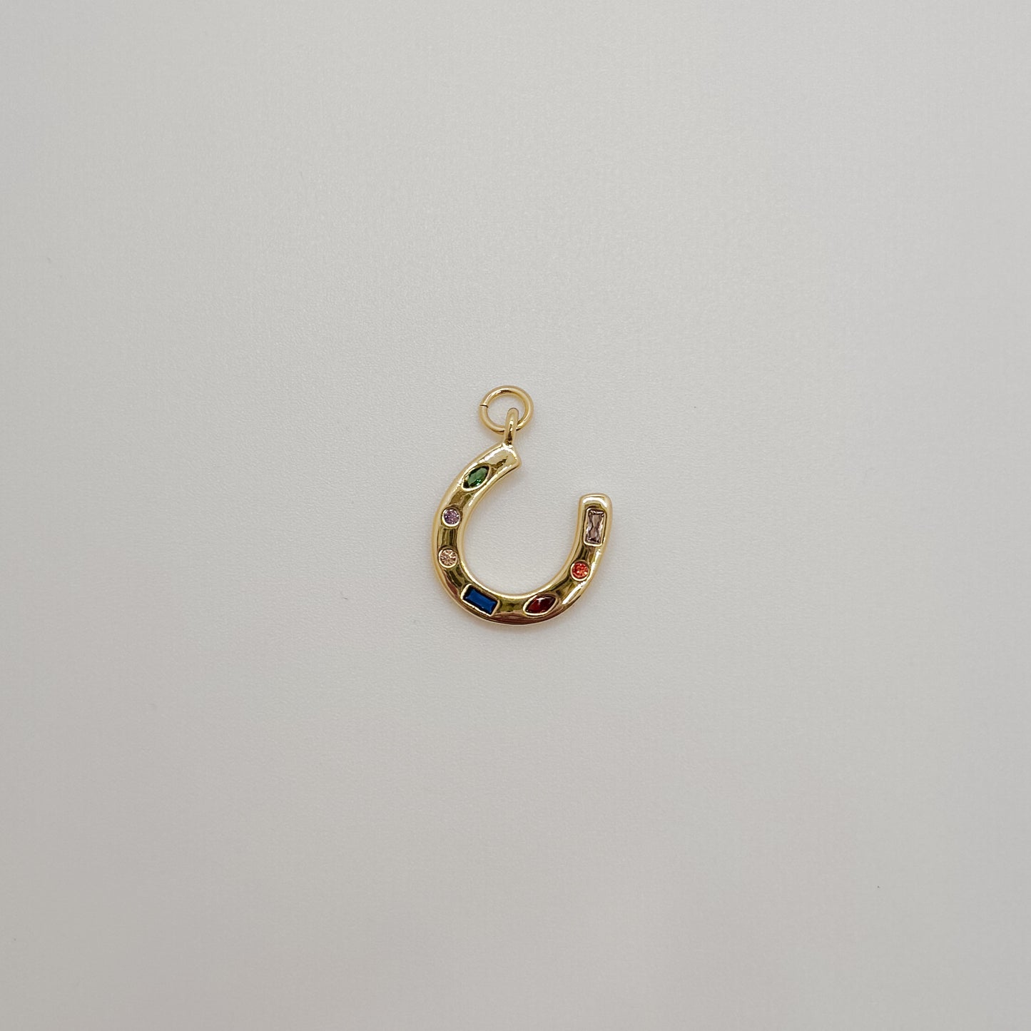 Small gold gemstone horse shoe