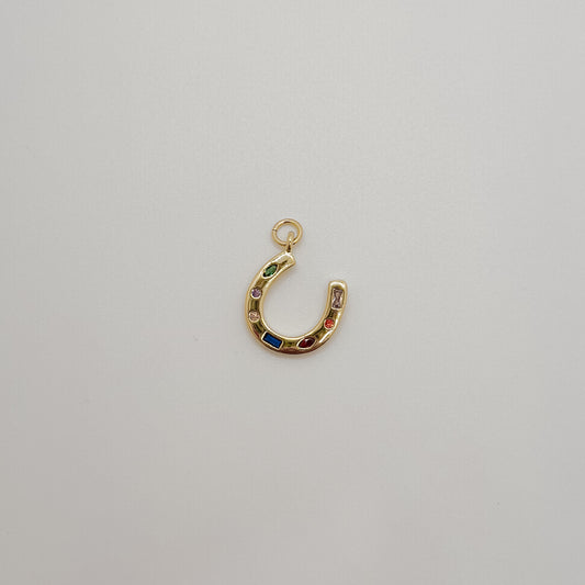 Small gold gemstone horse shoe