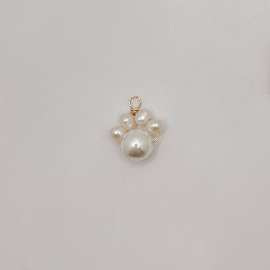 Gold pearl dog paw