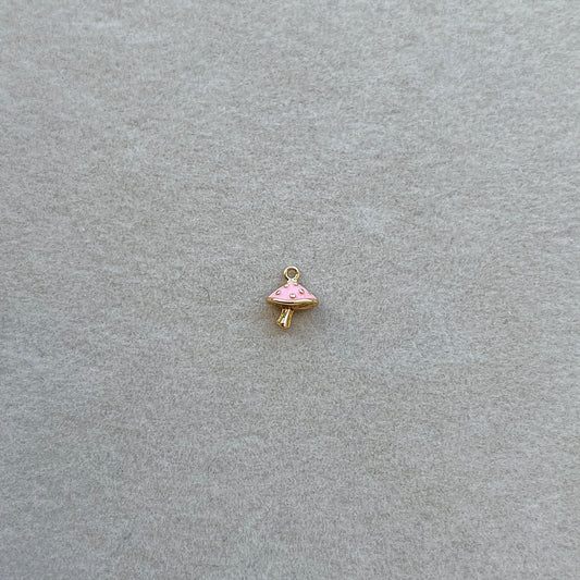 Tiny gold pink mushroom