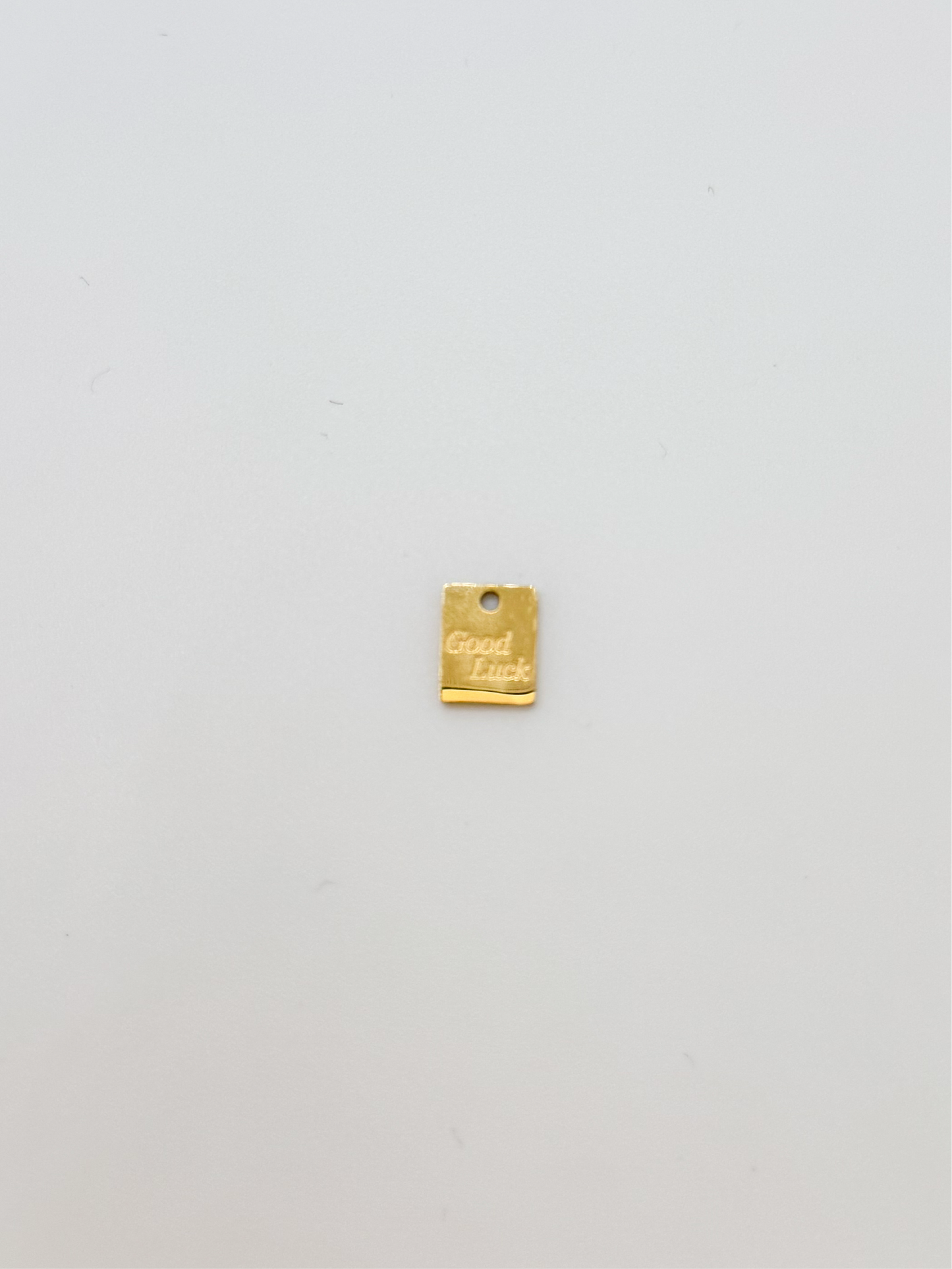 Tiny gold square good luck