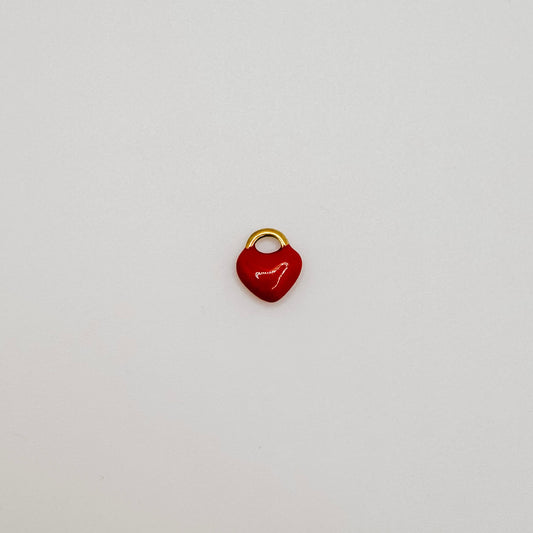 Tiny gold red heart