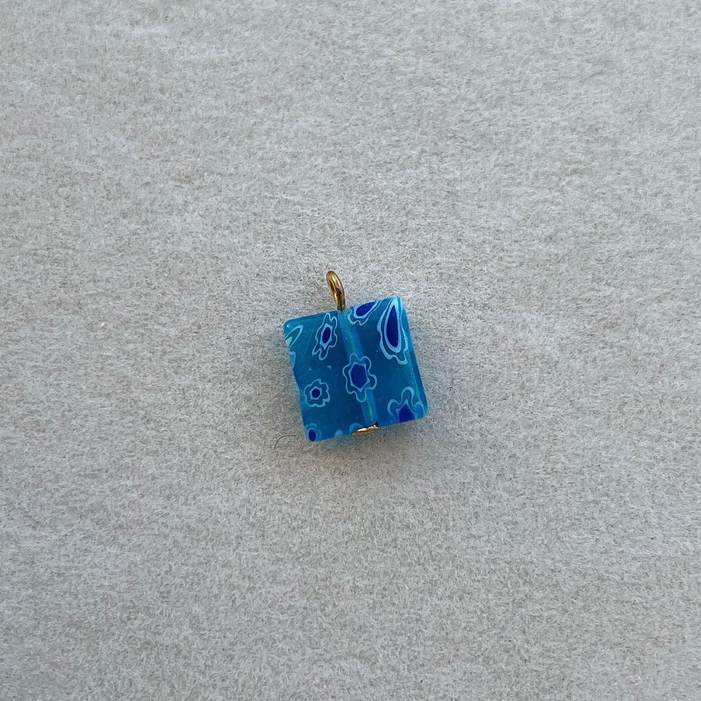 Gold square light blue glass bead