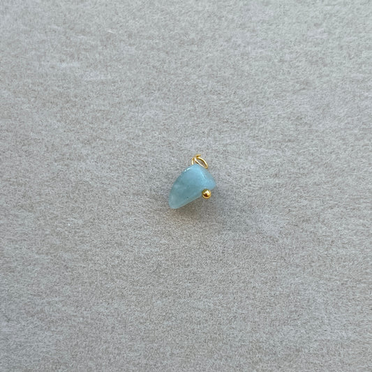 Tiny gold light blue gem