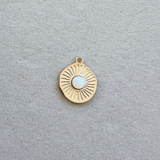 Gold textured circle with white gem