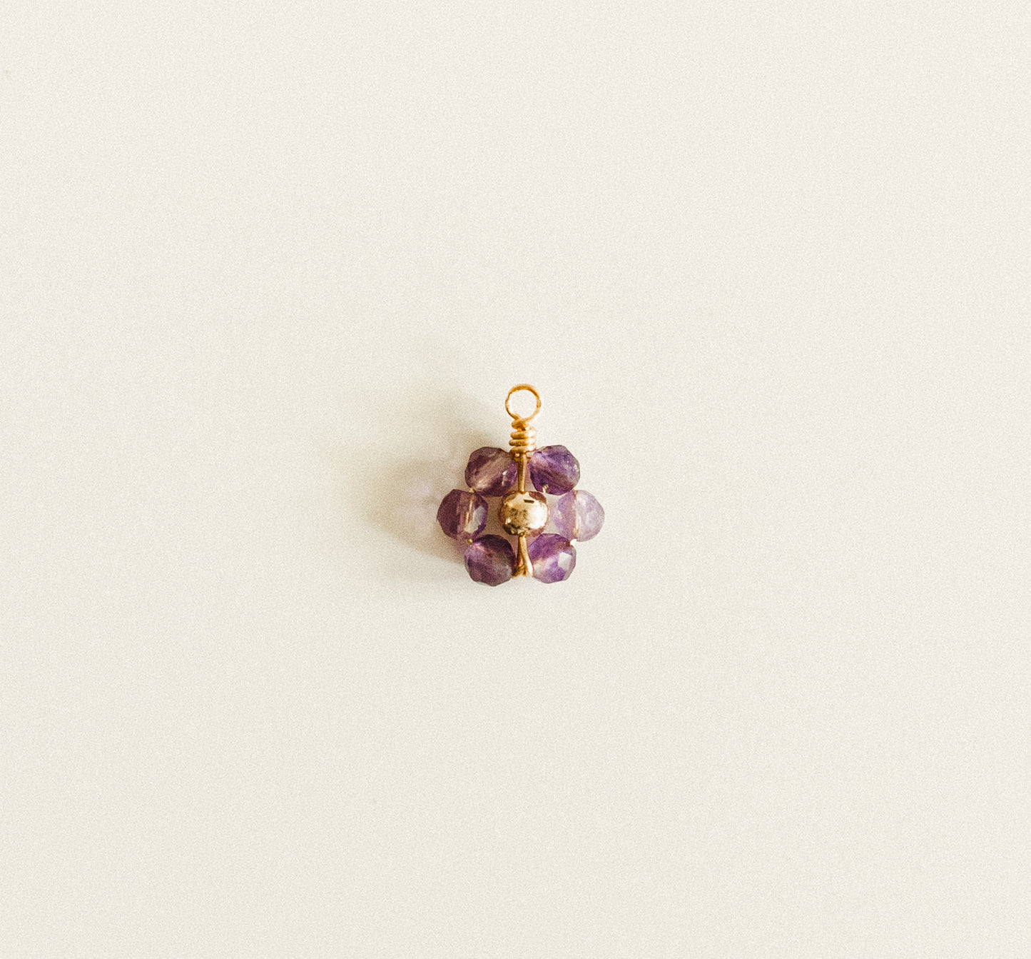 Small gold dark purple bead flower