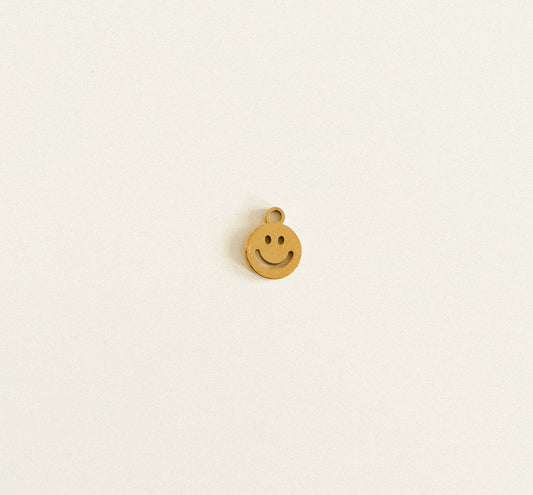 Tiny gold hollow smiley