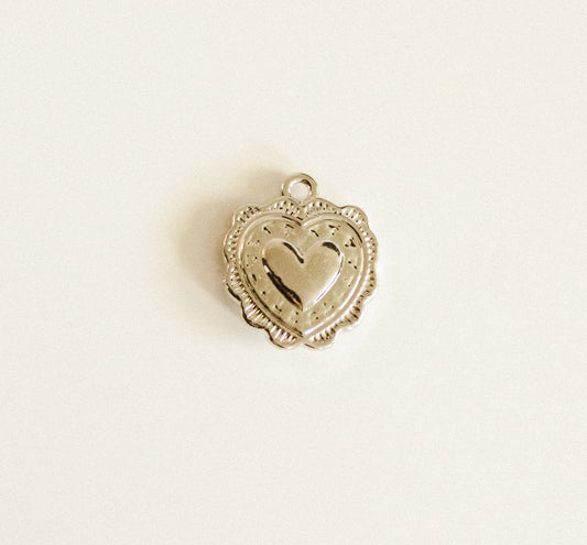 Silver heart with designs