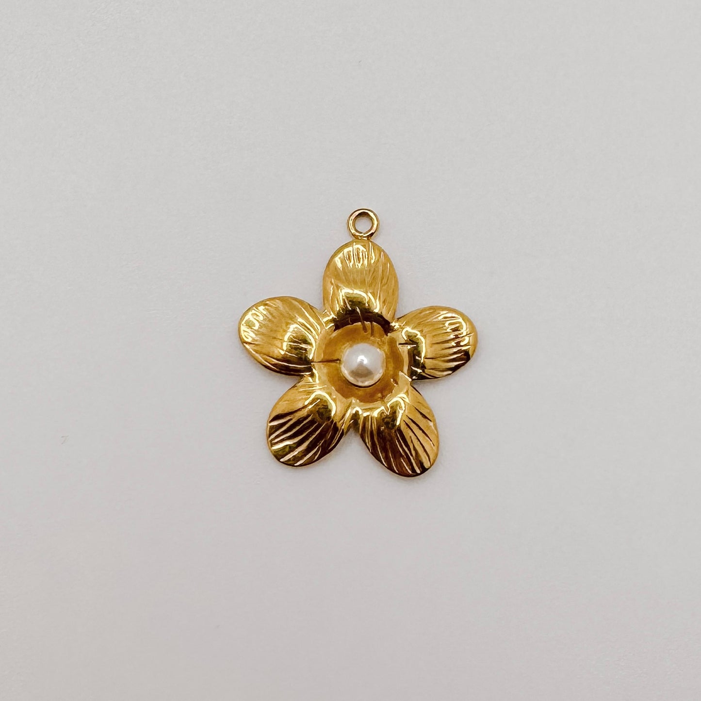 Large gold flower with pearl